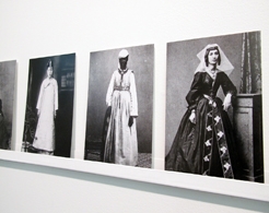 Installation view of black and white postcards