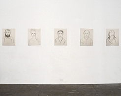 Portraits from Jadranka Kosorcic on gallery wall