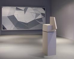 Gallery view of abstract sculpture next to large-scale painting