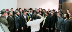 Conductor guiding chorus of bearded men