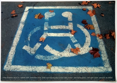Photo of handicap parking spot, with fall leaves over top
