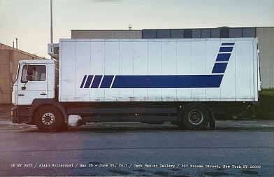Truck with artist work on cargo