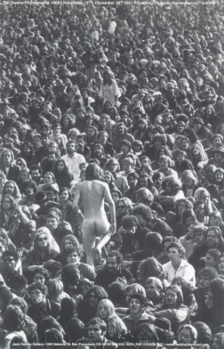 Photo of nude man walking past crowd of people