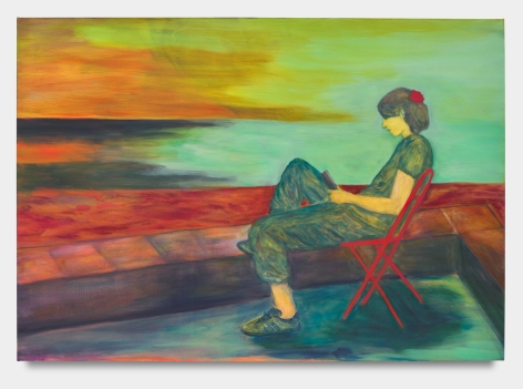 Woman sitting on red chair on phone