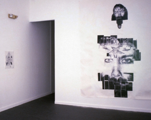 Installation view, large works on paper, black and white image of face
