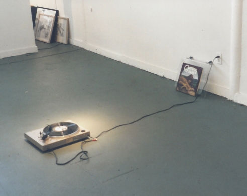 Record player on gallery floor